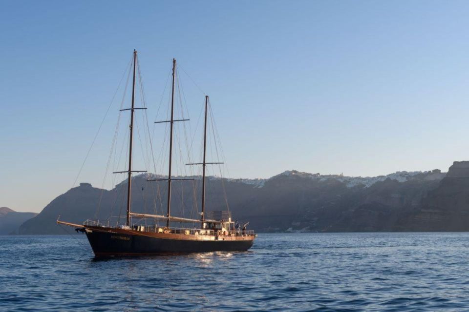1-Day Boat Trip: Santorini Volcano, Thirassia & Oia Sunset - Sailing back under Oia: the caldera photo angle you can’t fake