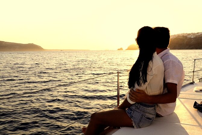 ALL-INCLUSIVE: Santorini Caldera Cruise with Greek Meal & Drinks - Stop 1: Red Beach swim, but anchored offshore