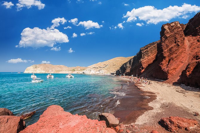 Archaeological Bus Tour To Akrotiri Excavations & Red Beach - Perissa or Perivolos black sand: swim time, tavern food, and wind reality