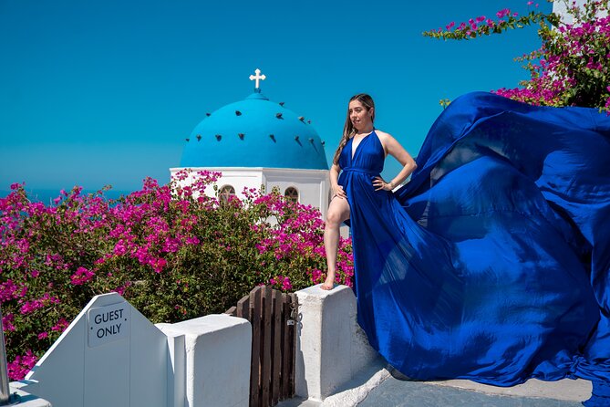 Flying Dress Photoshoot in Oia Private entry to Blue Dome - Photo package: 20–30 shots you can actually use
