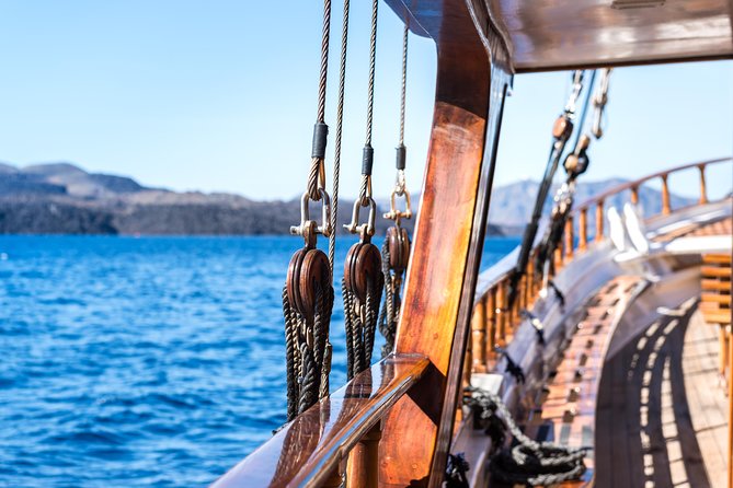 Full Day Boat Tour to Caldera Islands & Sunset in Oia by bus - Getting to the boat: pickup, boarding, and group reality