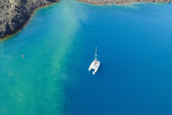 Full Day Santorini Catamaran Private Cruise with meal and transfer - Palea Kameni: volcanic island time inside the caldera