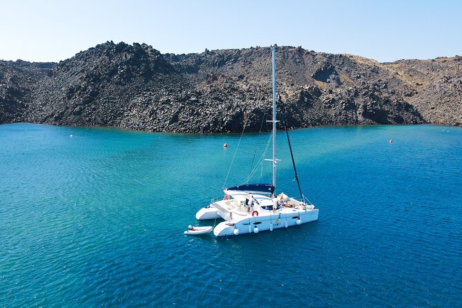Full Day Santorini Catamaran Private Cruise with meal and transfer - Nea Kameni hot springs: a sulfur soak that’s more about the feeling than the science