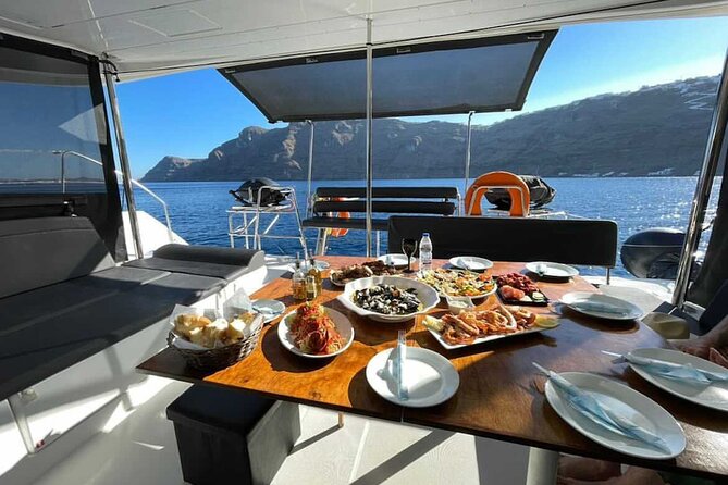 Half Day Premium Catamaran Cruise in Santorini including Oia - Red Beach and the warm volcano waters: the swimming-focused route