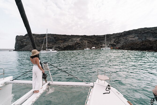 Half-Day Tailor-made Private Catamaran Cruise in Santorini - Passing Akrotiri’s lighthouse and Old Harbor: built for views, not extra stops