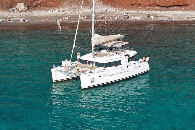 Luxury Santorini Catamaran Cruise: Lunch, BBQ, Drinks, Transfers - Vlychada Port pickup and private transfers: less stress, more sea time