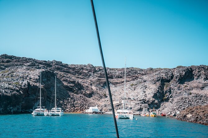 Majestic Catamaran Caldera Cruise with Snacks, Meal & Drinks - Stop 2: White Beach Snorkel and Caldera Cliff Views