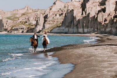Private Horse Riding Experience in Santorini - Eros Beach at the end of the trail: black sand, lava stones, and sea time