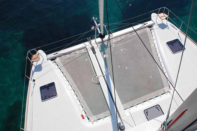Private Morning Tour Lagoon 400-380 Sailing in Santorini ,lunch, drink, transfer - The sea-side viewing stops: Old Lighthouse, Indian Rock, Aspronissi, and more