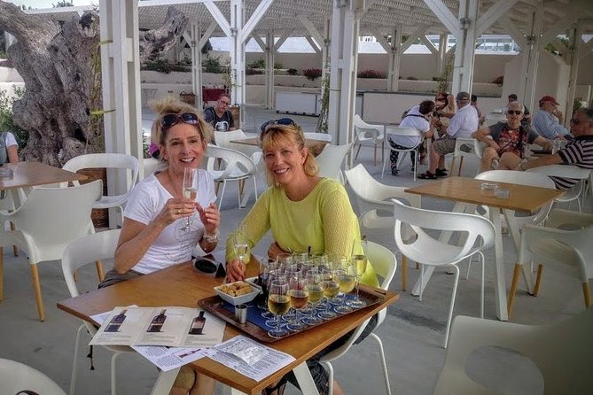 Private Santorini History and Wine Tasting 5-Hour Tour - Food and comfort: small bites, bottled water, and air-conditioned transport