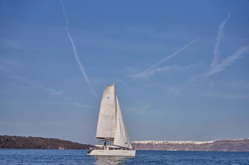 Santorini: Caldera Classic Catamaran Cruise w/ Meal & Drinks - Red Beach: Scarlets, Snacks, and Your First Swim Stop
