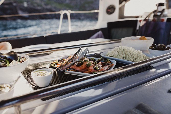 Santorini Caldera Private Sailing Boat Cruise - The onboard experience: crew care, music choices, and the food