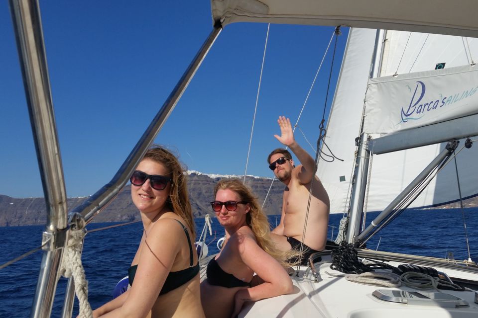 Santorini Caldera: Sunset Sailing Cruise with Meal - Indian Rock, lighthouse views, and the move deeper into the caldera