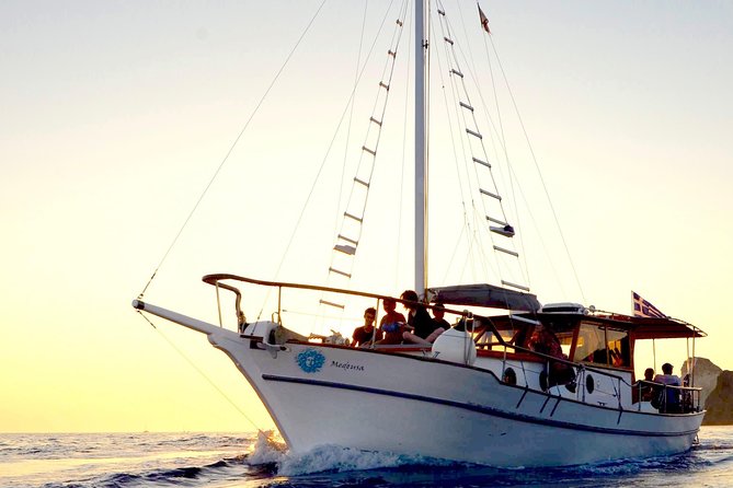 Santorini Caldera Sunset Traditional Cruise with Meal and Drinks - Thirassia stop: fishermen’s island vibes plus snorkeling time