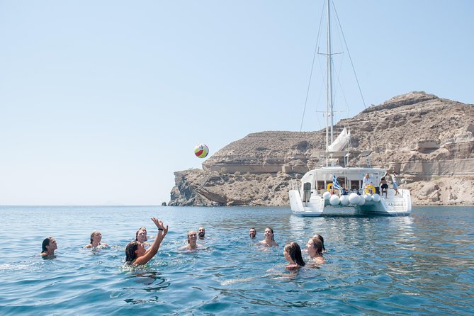 Santorini Catamaran Cruise with Fresh Meal and Open Bar - From Akrotiri’s lighthouse to Indian Rock: what the scenery looks like from sea level