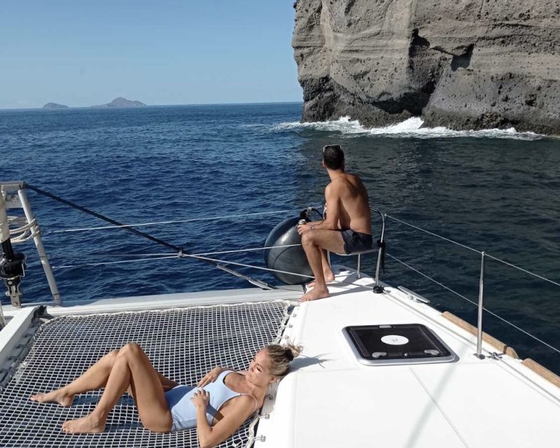 Santorini: Catamaran Cruise with Lunch, Drinks, & Oia Visit - White Beach, Red Beach, and the lighthouse moments you can’t skip