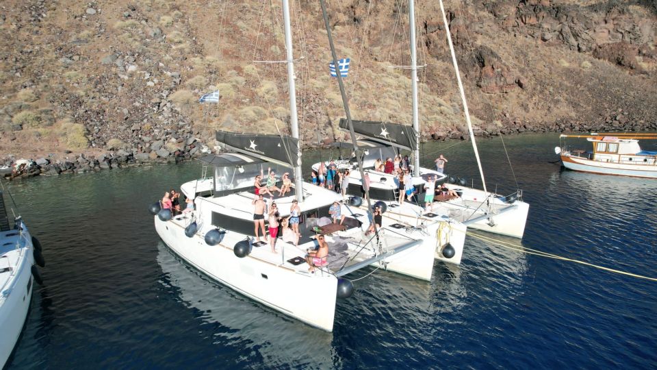 Santorini Catamaran Cruise with Swimming, Meal and Open Bar - Palea Kameni hot springs: warm water, plus the “why” behind it