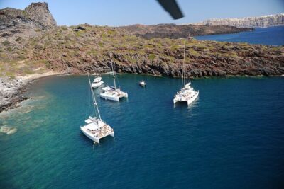 Santorini Classic Catamaran Cruise with BBQ, Drinks and Transfers - Mesa Pigadia swim stop: your first real chance to snorkel