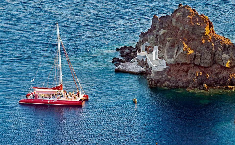 Santorini: Cruise Catamaran with BBQ & Drinks Day or Sunset - Getting there: hotel pickup near Thera and smooth transfers