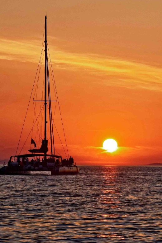 Santorini: Cruise Catamaran with BBQ & Drinks Day or Sunset - Red Beach: where swimming and snorkeling actually happen