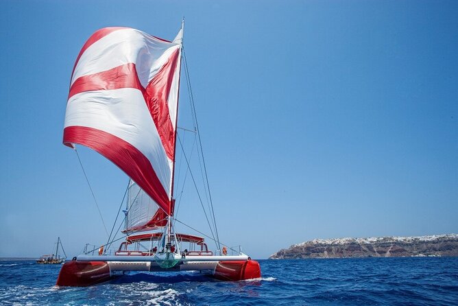 Santorini Cruise on Catamaran with BBQ & Open Bar - Red Beach: Photos, Quick Swim, and Snorkel Time