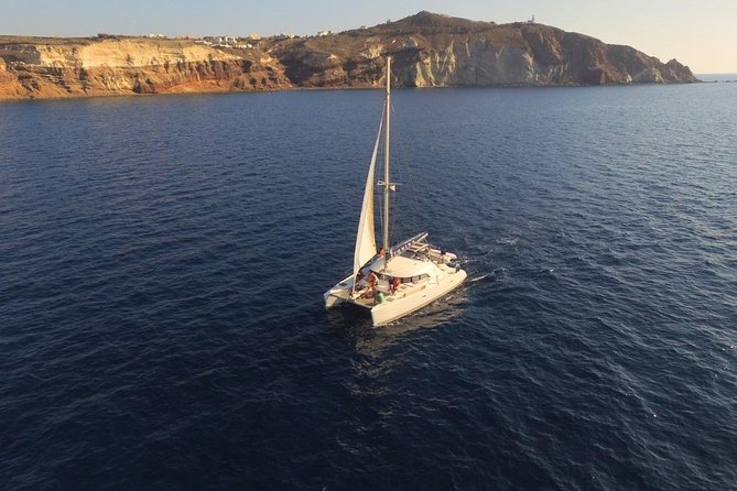Santorini Full Day Catamaran Private Cruise incl. Meal, Drinks & Free Transport - The Faros Lighthouse (Akrotiri): Short Stop, Big “Where Am I” View