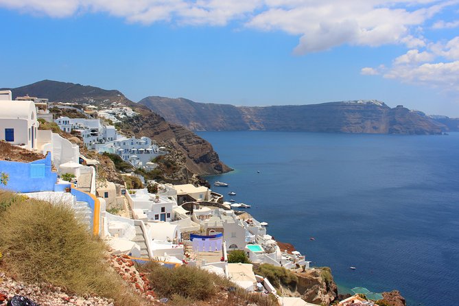 Santorini Full Day Tour - Palea Kameni hot springs: green sulphur water and boat-dock reality