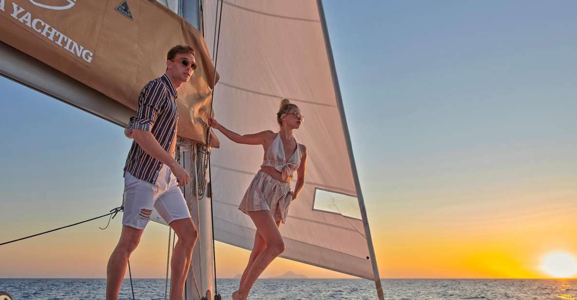 Santorini Gold Catamaran Cruise with Snorkel, BBQ & Open Bar - Red Beach snorkeling stop: iconic cliffs, real swim time
