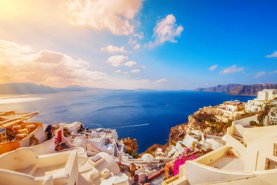 Santorini: Guided Island Day Trip with Beach Visit - Fira’s cliff town time: photos, traditional food, and getting oriented