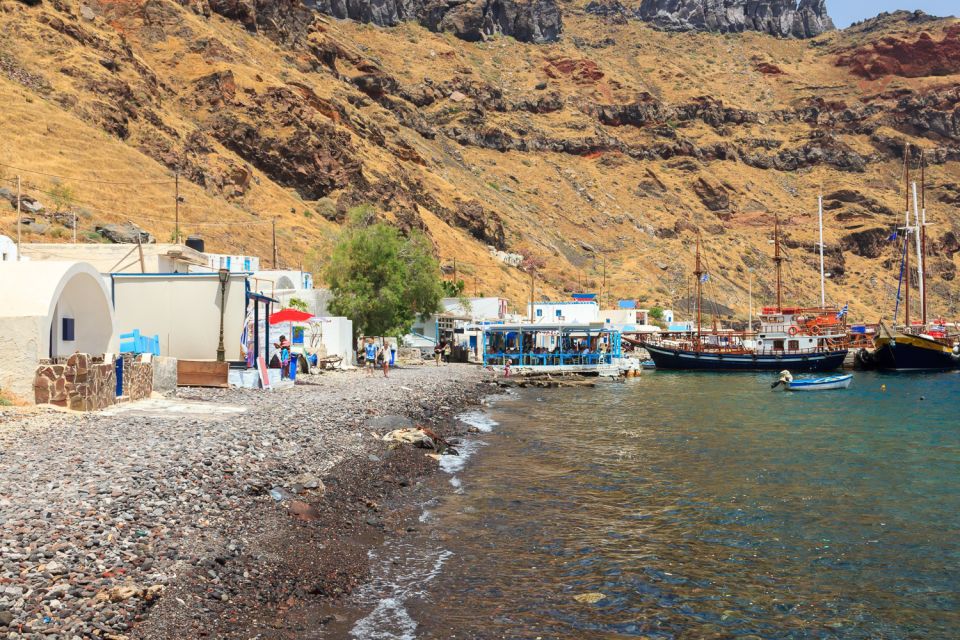 Santorini Island Bus Tour and Caldera Sunset Cruise - Oia at sunset: Ammoudi steps, timing, and the return bus