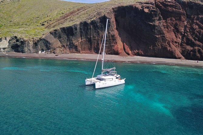 Santorini: Luxury Catamaran Cruise with Fresh Fish BBQ & Drinks - Stop 2: Mesa Pigadia’s Secluded Black-Sand Swim