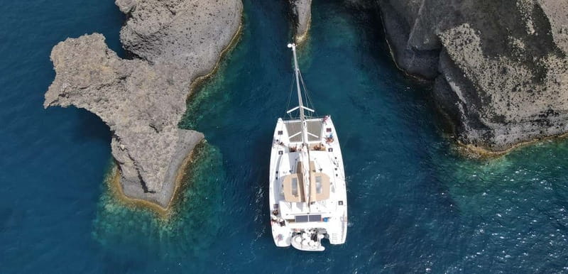 Santorini: Luxury Catamaran Cruise with Lunch, BBQ & Drinks - Palea Kameni hot springs: warm sulphur water with a real-world downside