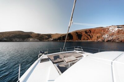 Santorini Luxury Catamaran Private Cruise - Sailing the South Coast and Caldera Highlights: Red and White Beach, Caves, Lighthouse, and Indian Rock