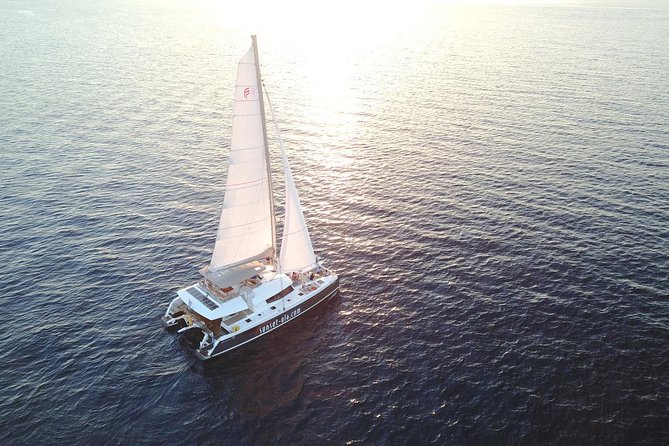 Santorini Luxury Catamaran Sunset Cruise with BBQ, Drink and Transfer - Sailing past the Volcano and Palea Kameni: the views are the point