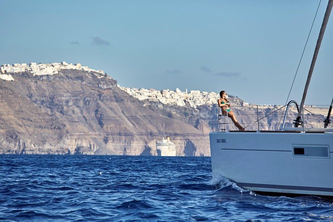 Santorini Luxury Sailing Catamaran Cruise with BBQ, Drinks and Transfer - Ancient lighthouse views from the sea (and why this stop is worth it)