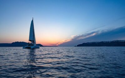 Santorini: Luxury Sunset Cruise with Dinner & Open Bar - Caldera cliffs and the route toward Thirassia