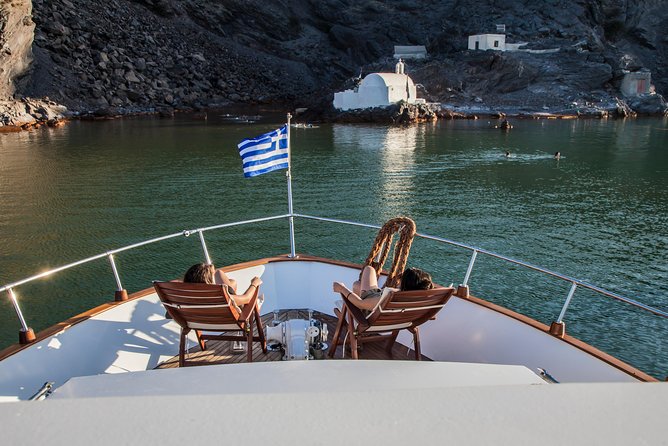 Santorini: Motor Yacht Private Cruise with 5-Course Meal - Pickup, comfort, and the reality of anchored swimming