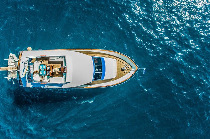 Santorini: Motor Yacht Sunset Cruise with 5-Course Dinner - Oniro yacht, $80 value, and what “all-inclusive” really means