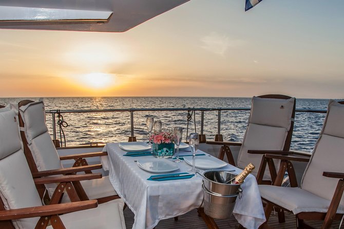 Santorini: Motor Yacht Sunset Cruise with 5-Course Dinner - The onboard 5-course dinner: when it lands and how it tastes