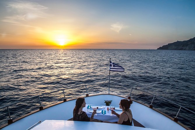 Santorini: Motor Yacht Sunset Cruise with 5-Course Dinner - From Vlihada past red and white beaches to Akrotiri Lighthouse