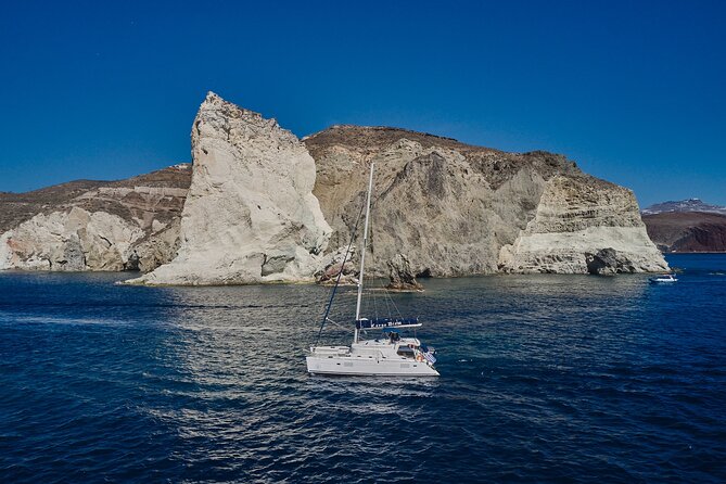Santorini Oia: Luxury Sunset Cruise with Fresh Fish BBQ & Drinks - Oia’s sunset, but with the water doing the heavy lifting