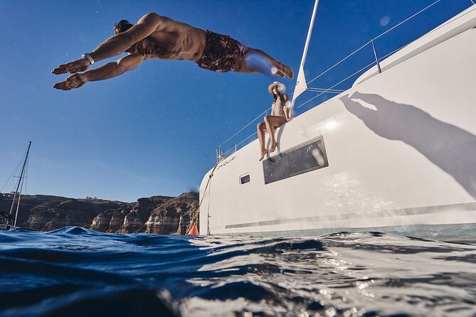 Santorini Oia: Luxury Sunset Cruise with Fresh Fish BBQ & Drinks - Sunset watch from the sea: the payoff for a long day