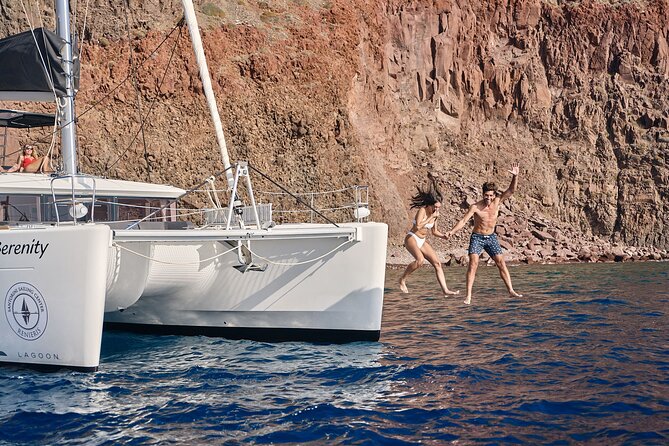 Santorini Oia: Private Sunset Catamaran Cruise with BBQ & Drinks - Stop 1: Thirassia swimming at a slower pace