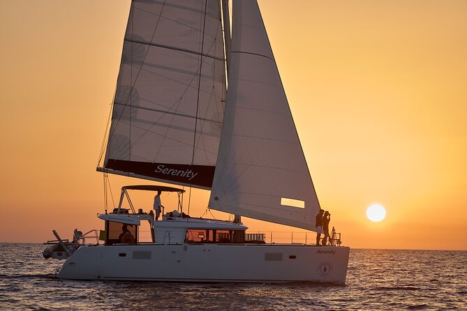 Santorini Oia: Private Sunset Catamaran Cruise with BBQ & Drinks - The sea-side lighthouse moment (quick, charming, and very photogenic)