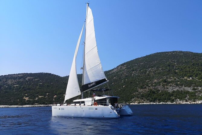 Santorini Oia: Private Sunset Catamaran Cruise with BBQ & Drinks - Beach hopping by boat: Mesa Pigadia, White Beach, and Red Beach
