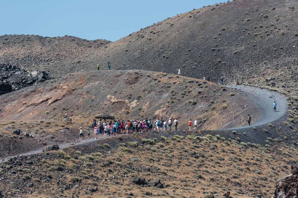 Santorini Port: Cruise to Volcano, Hot Springs & Thirassia - The ride back through the caldera: views, music, and extra photo angles