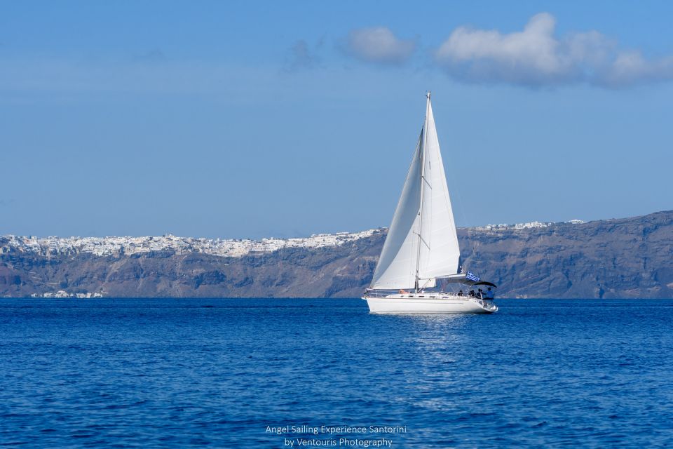 Santorini: Private 5-Hour Sunset Sailing Tour with Dinner - Hot springs, the lighthouse overhead, and caldera corners worth slowing down