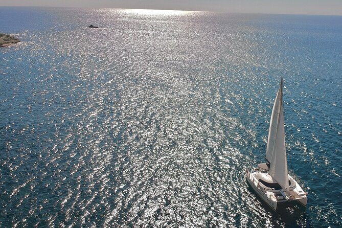 Santorini: Private All-In Catamaran Cruise (Food&Drinks) - Getting onboard safely: shoes off, net rules, and wet-deck reality