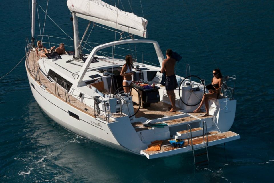 Santorini: Private Caldera Sailing Trip with Open Bar & Meal - Setting sail around Red Beach and the volcanic bays