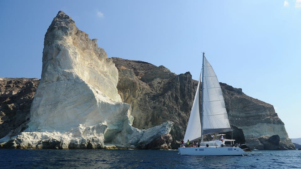 Santorini: Private Catamaran Tour with BBQ Meal and Drinks - Into the volcanic zone: Palia and Nea Kameni plus hot springs